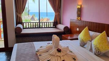 Deluxe Room, Sea View | Minibar, in-room safe, desk, free WiFi