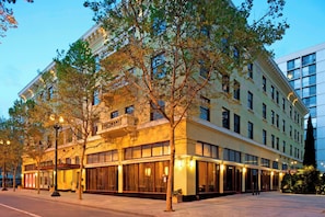 A multi-story hotel with large windows and a classic architectural style.