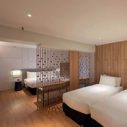 Premier Family Room | Minibar, in-room safe, desk, blackout curtains