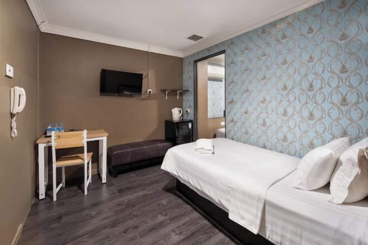 Desk, laptop workspace, free WiFi, bed sheets