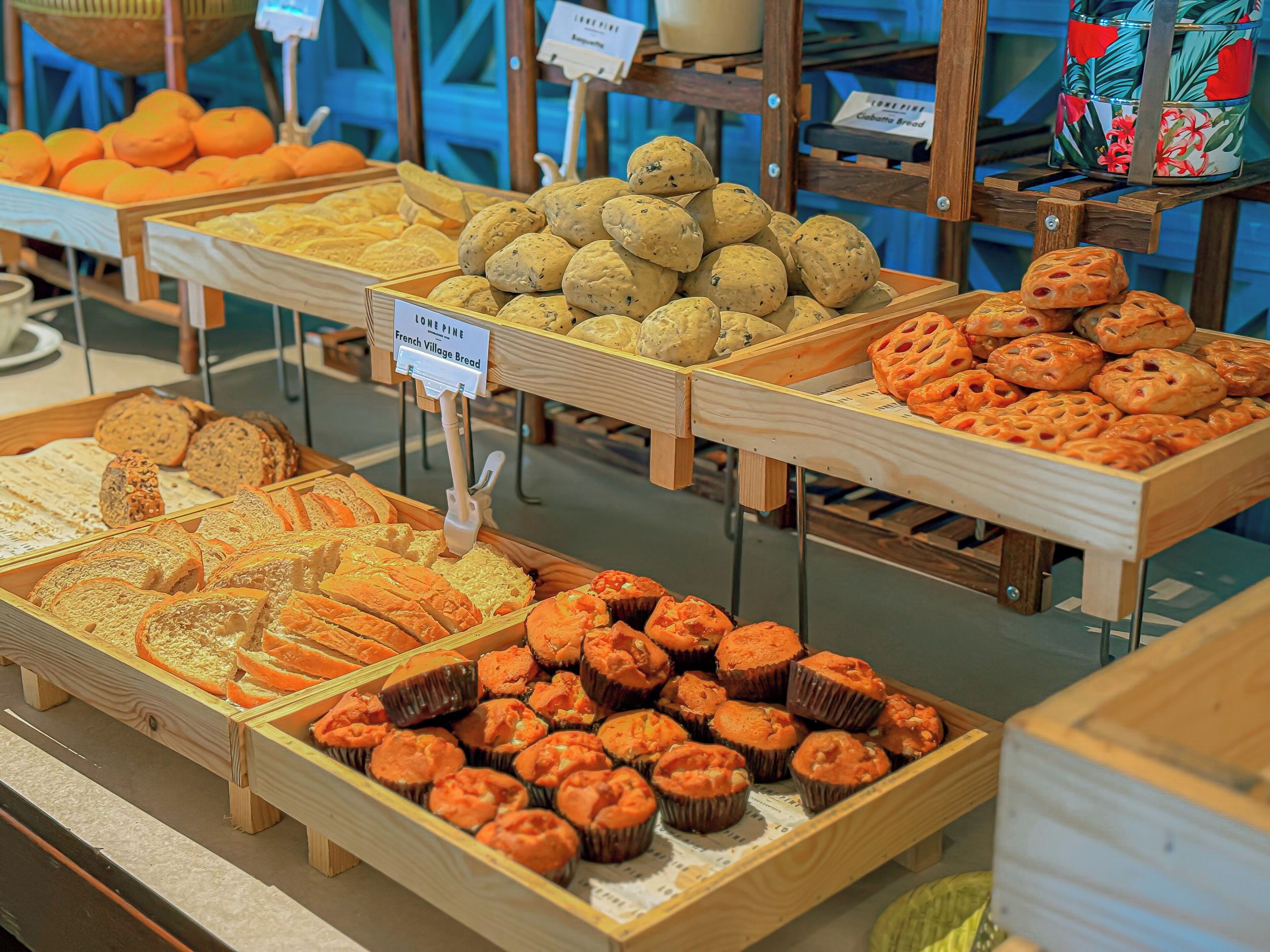 A bakery display with various baked goods.