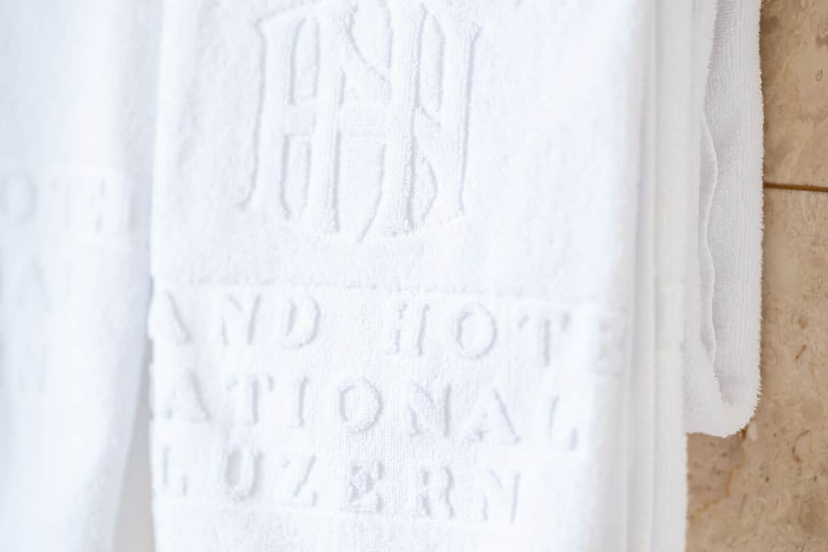 designer toiletries, hair dryer, bathrobes, slippers