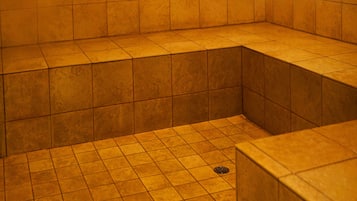 Bathroom features a bathtub and tile flooring.