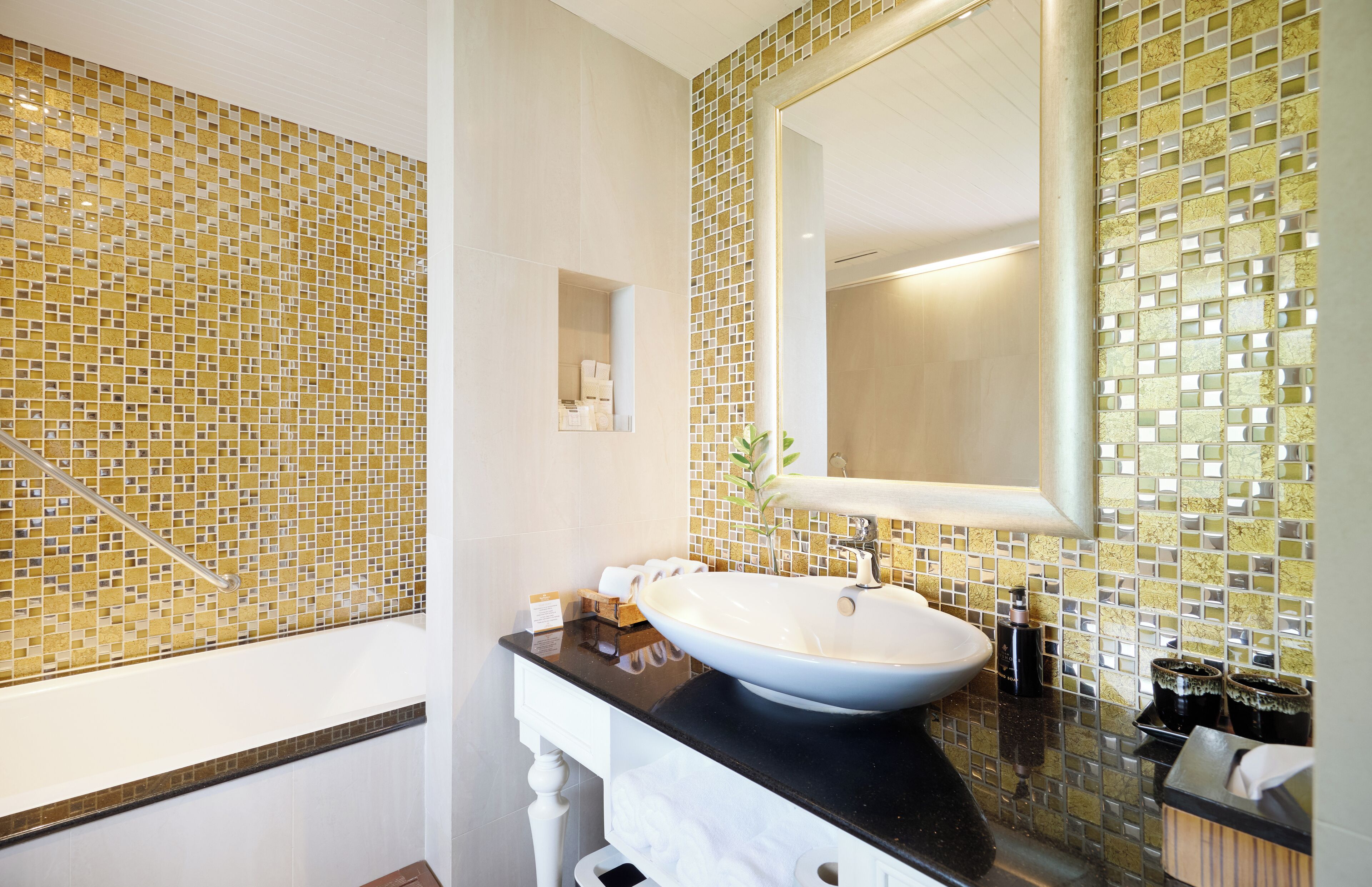 executive family suite | bathroom | separate bathtub and shower, rainfall showerhead, free toiletries