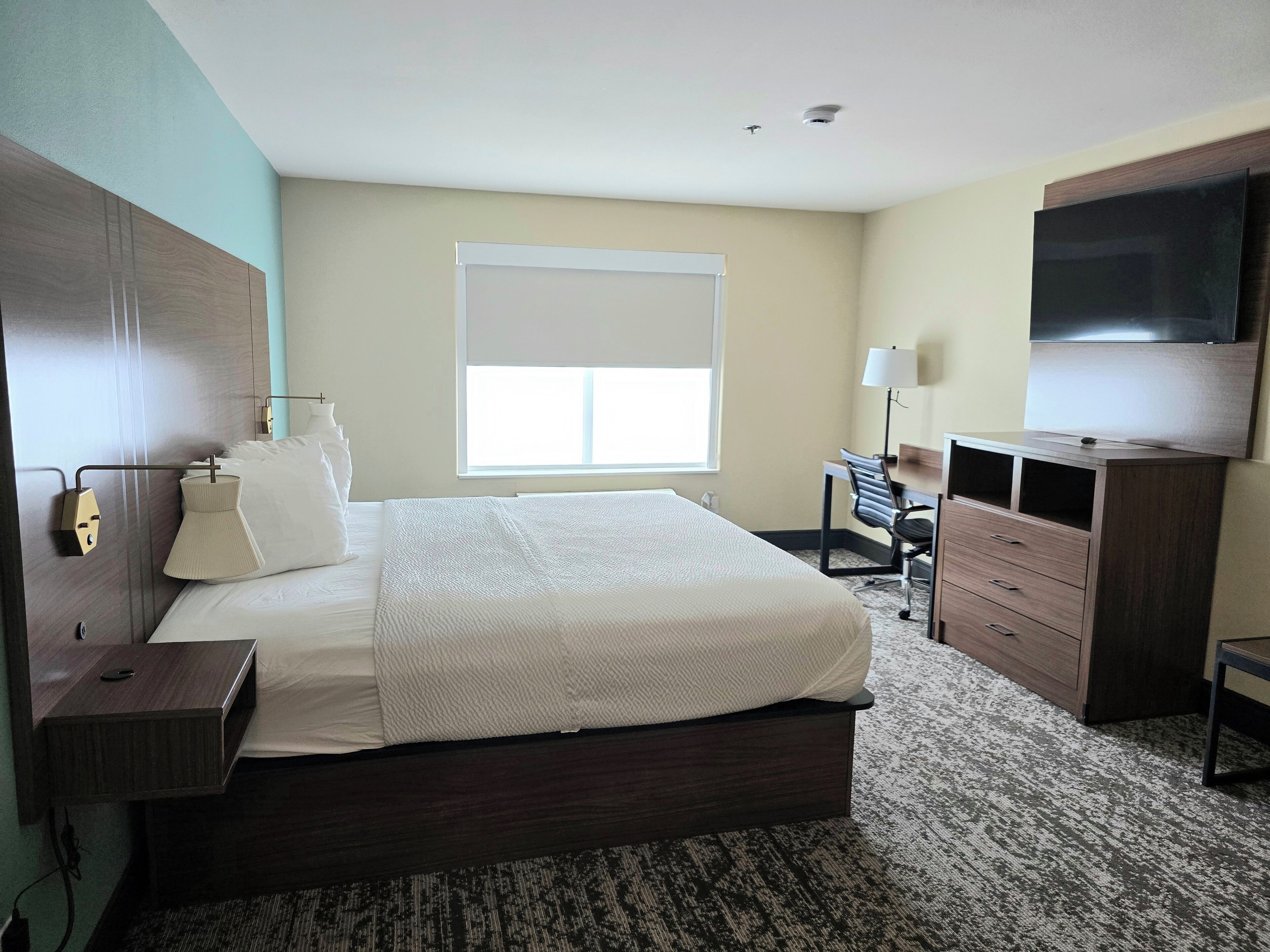 suite, 1 king bed, non smoking, refrigerator & microwave | pillow-top beds, desk, laptop workspace, iron/ironing board