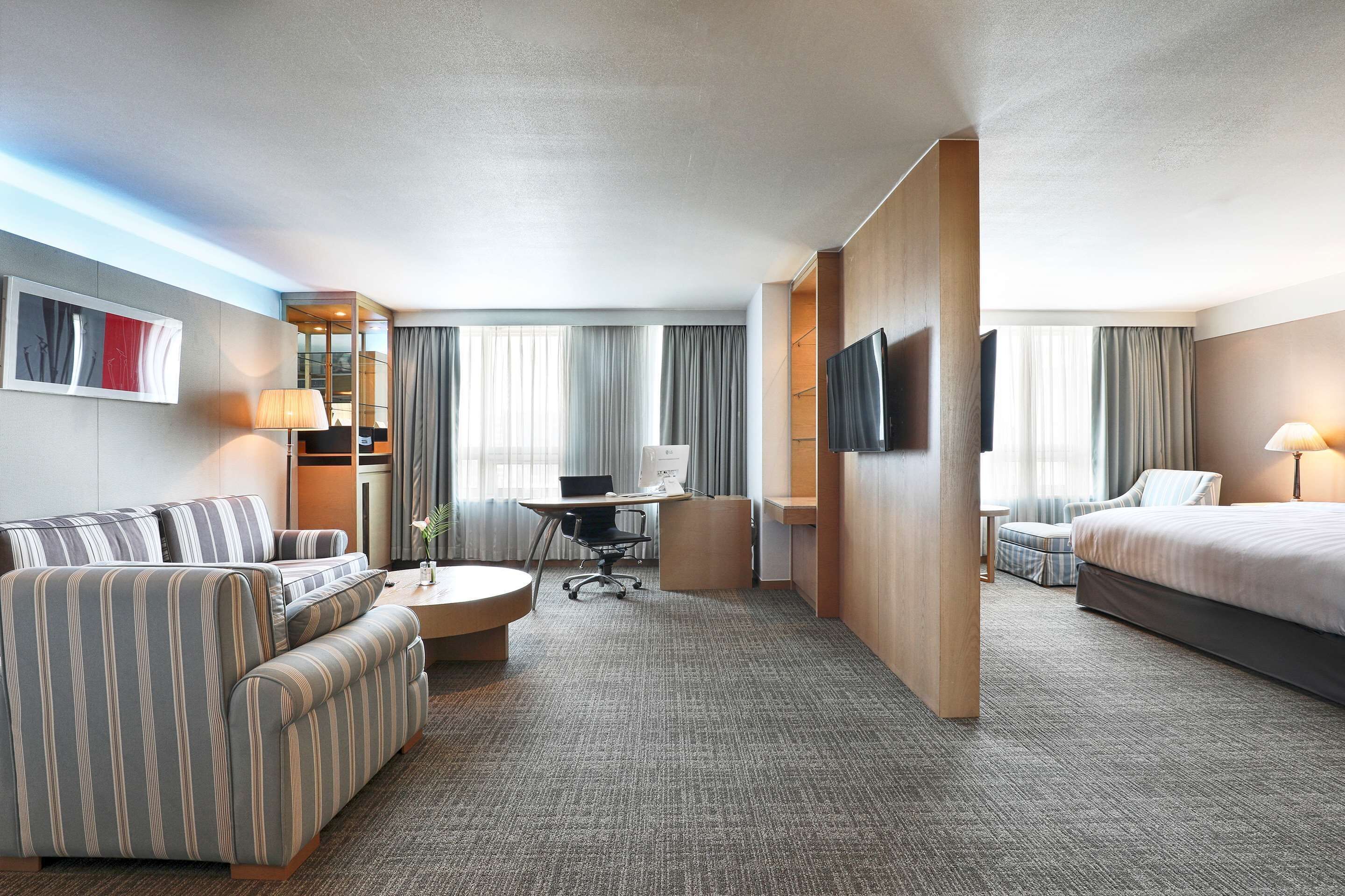 suite, 1 king bed, non smoking (living room) | down duvets, in-room safe, desk, blackout curtains