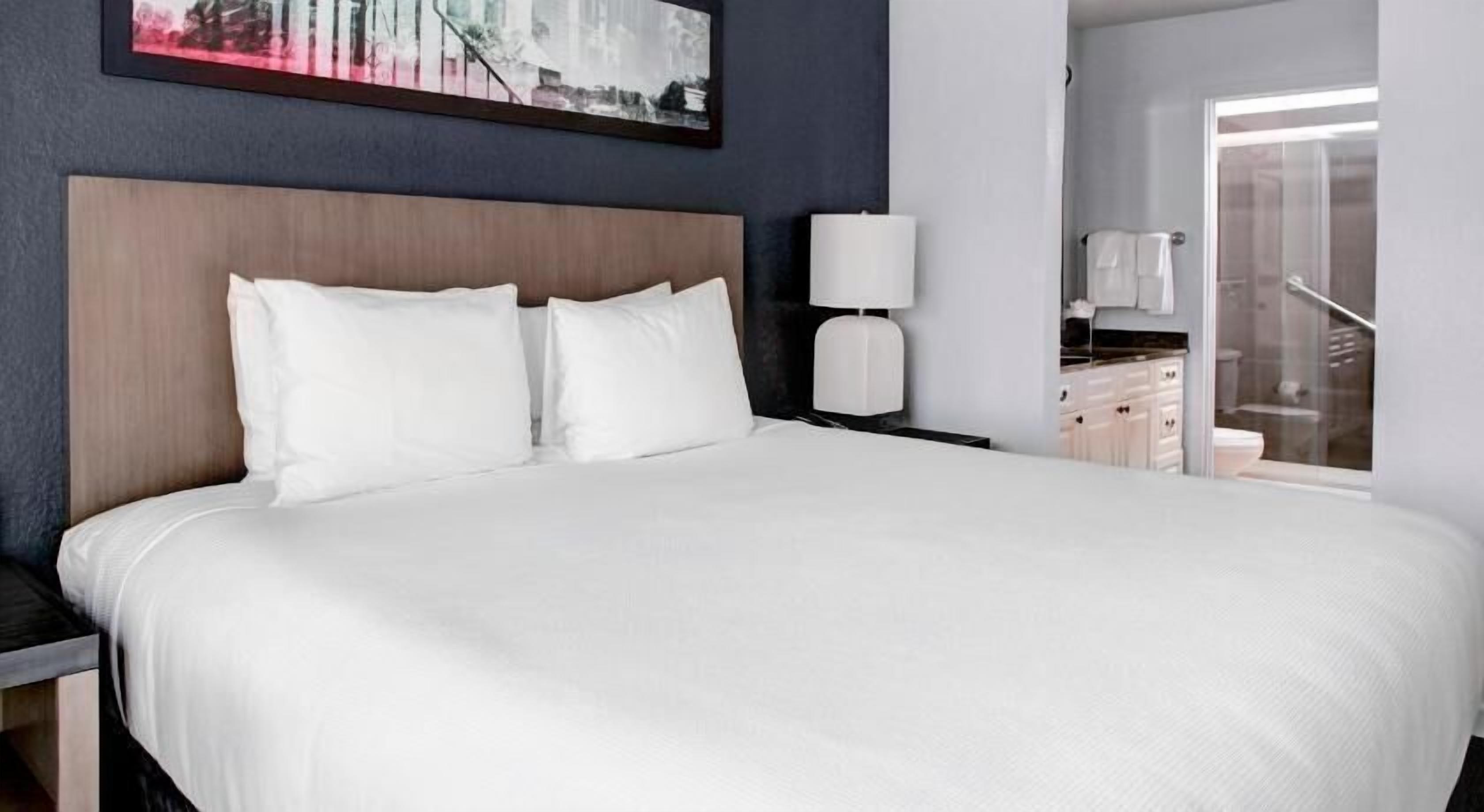 Premium bedding, pillow-top beds, desk, blackout curtains