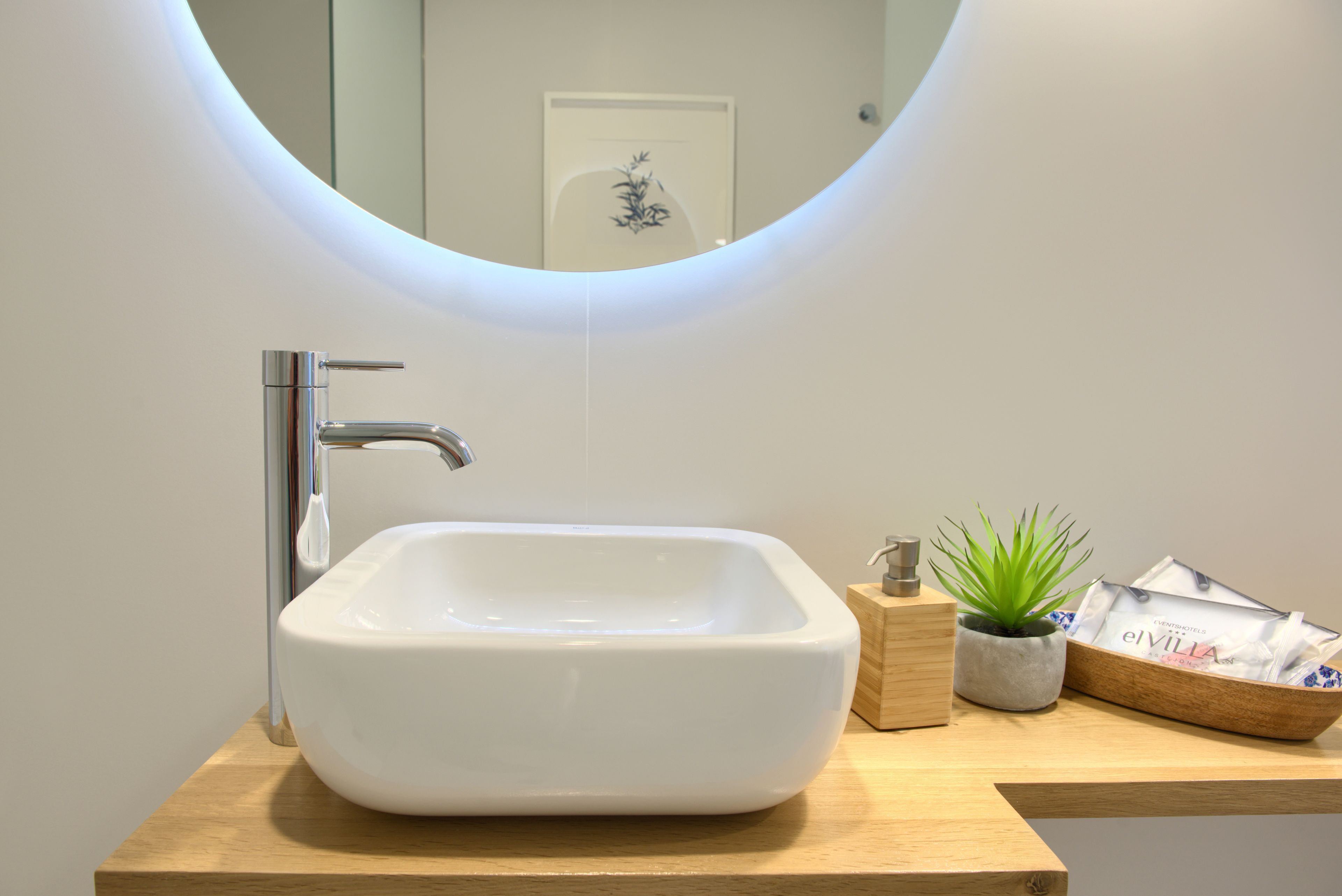 designer toiletries, hair dryer, towels, soap