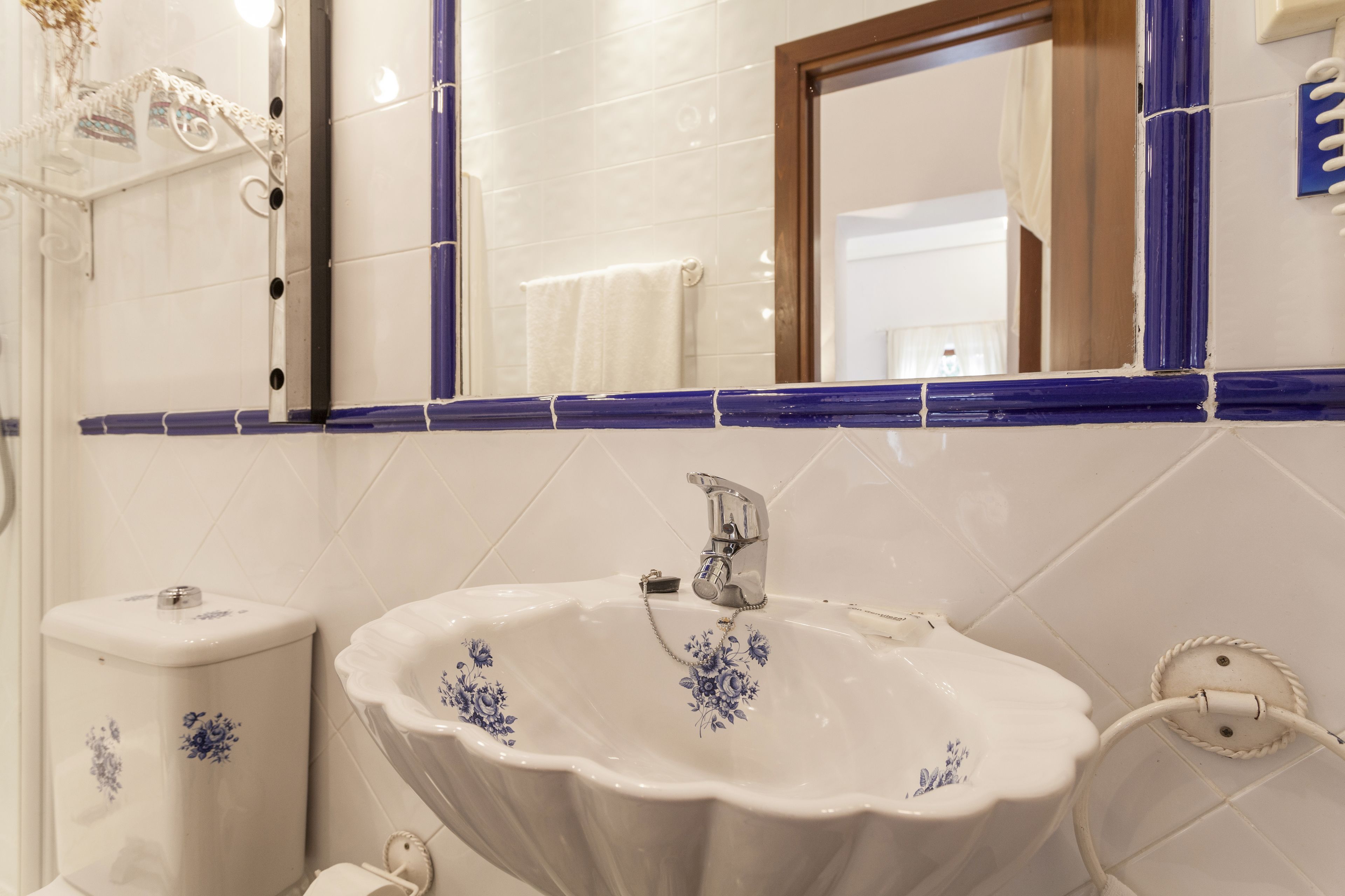 shower, designer toiletries, hair dryer, towels