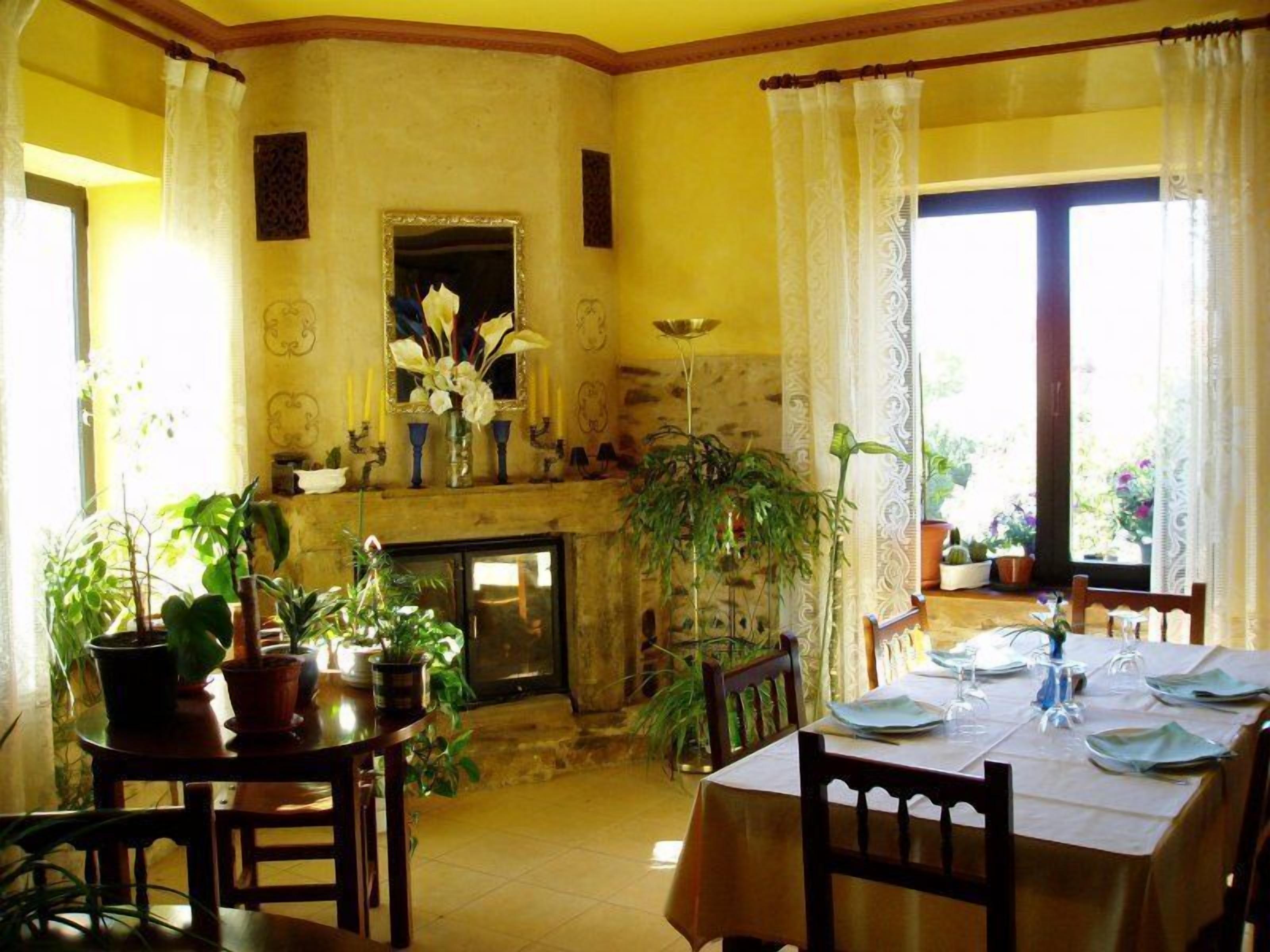 Breakfast, lunch, dinner served; Spanish cuisine, garden views 