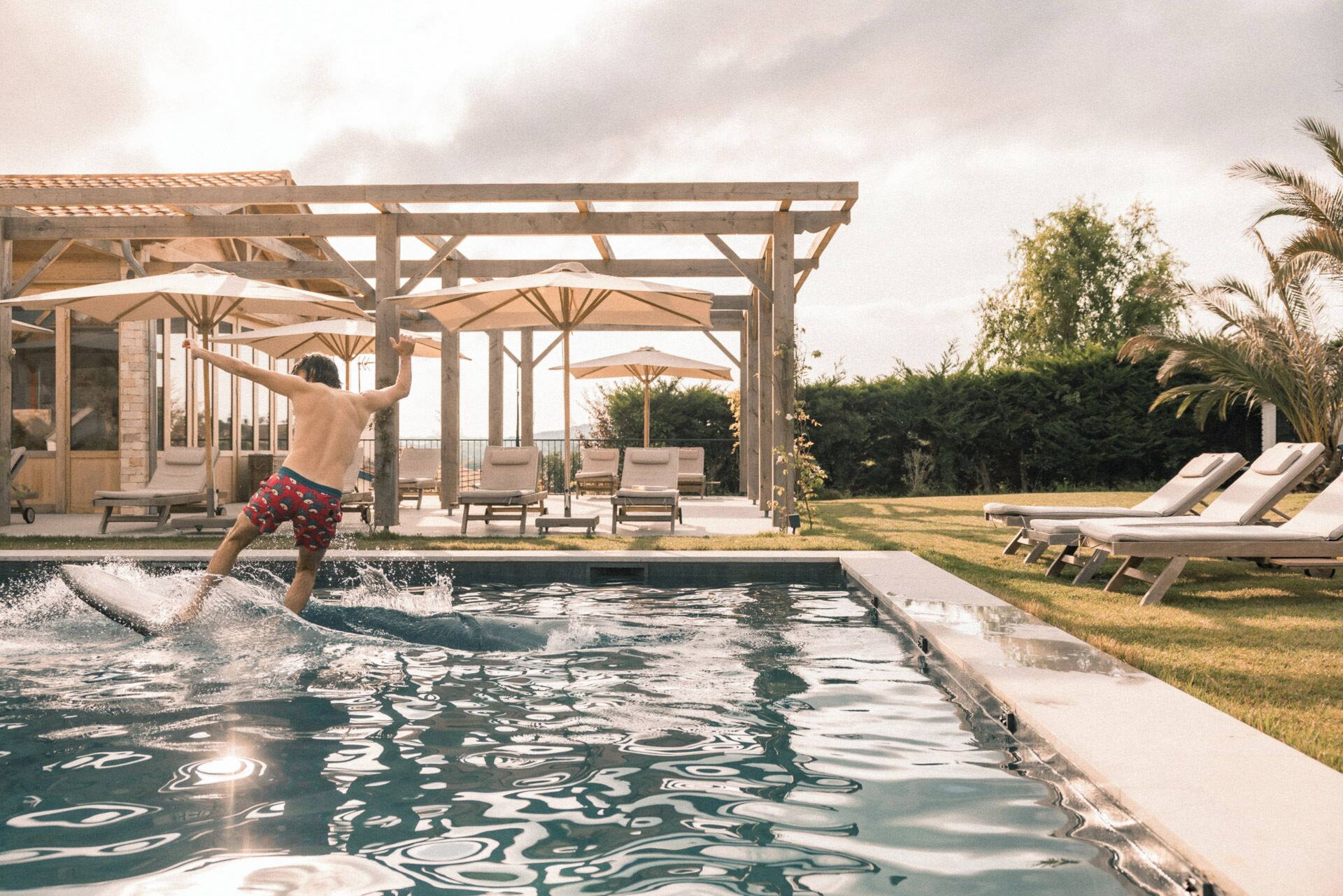 seasonal outdoor pool, open 9:00 am to 8:00 pm, pool umbrellas