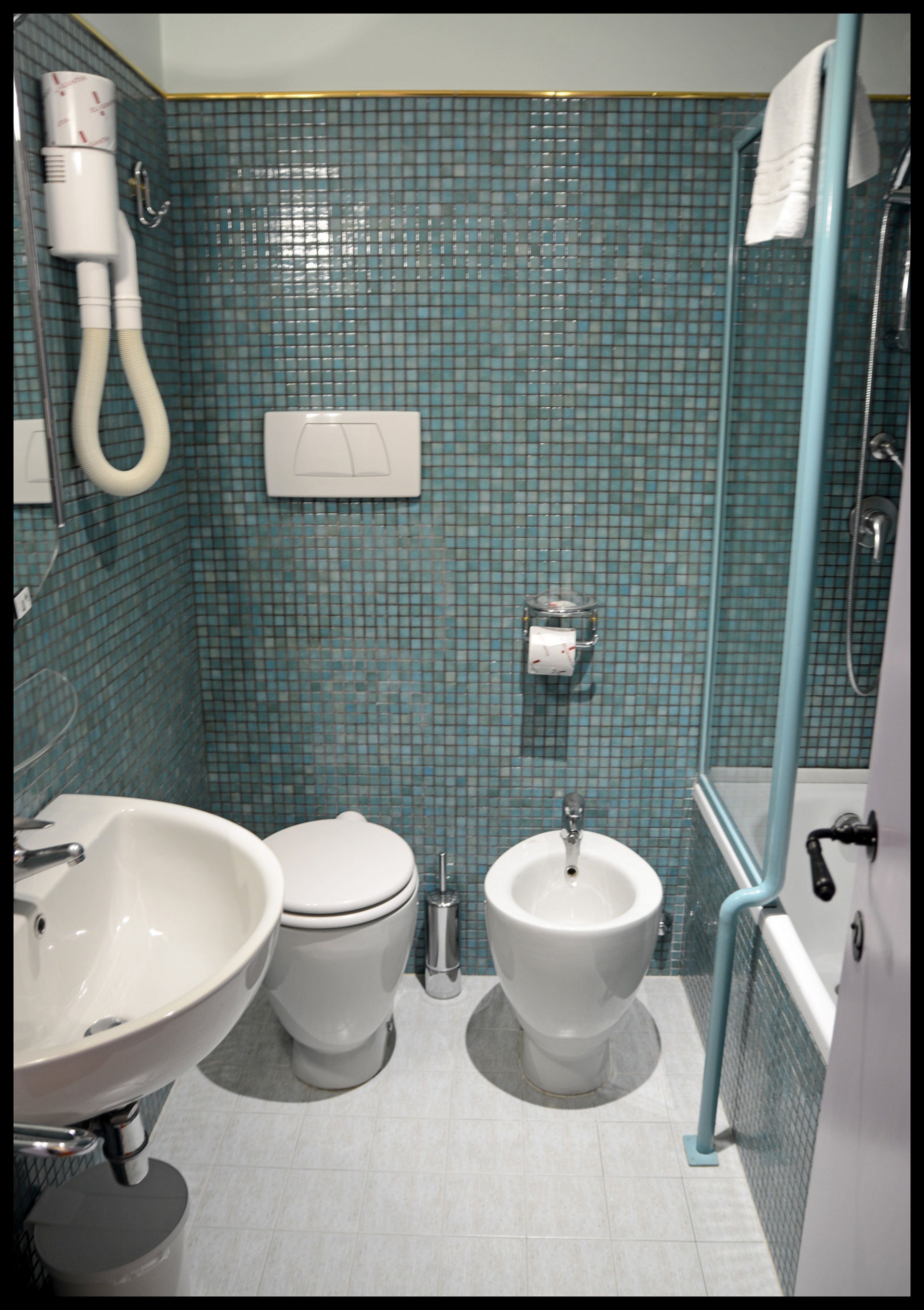 eco-friendly toiletries, hair dryer, towels