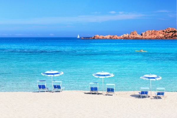 On the beach, white sand, free beach shuttle, beach umbrellas