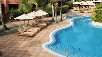 Indoor pool, outdoor pool, pool umbrellas, pool loungers