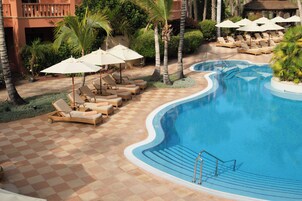 Indoor pool, outdoor pool, pool umbrellas, pool loungers