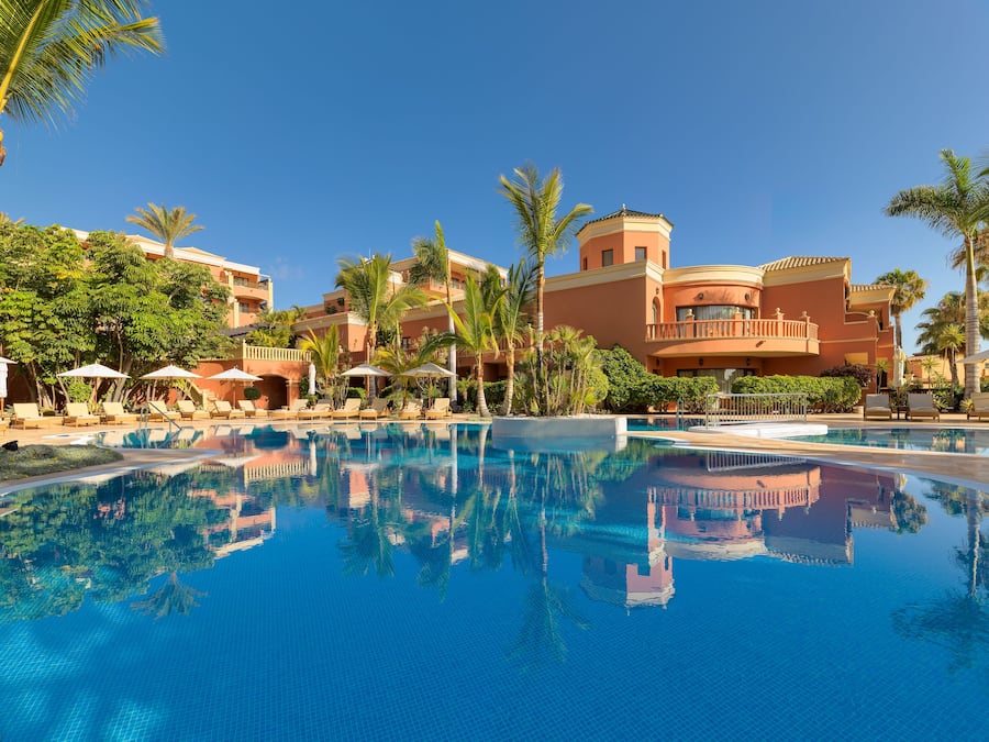 Indoor pool, outdoor pool, pool umbrellas, pool loungers