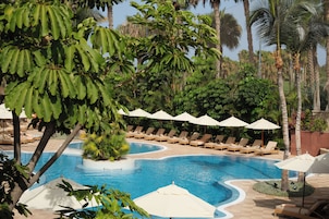 Indoor pool, outdoor pool, pool umbrellas, pool loungers
