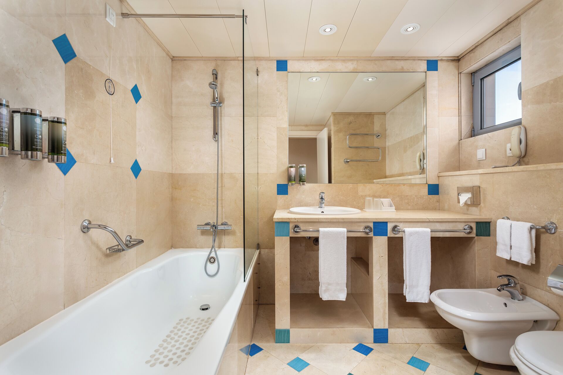 suite, resort view | bathroom | combined shower/bathtub, deep-soaking bathtub, free toiletries