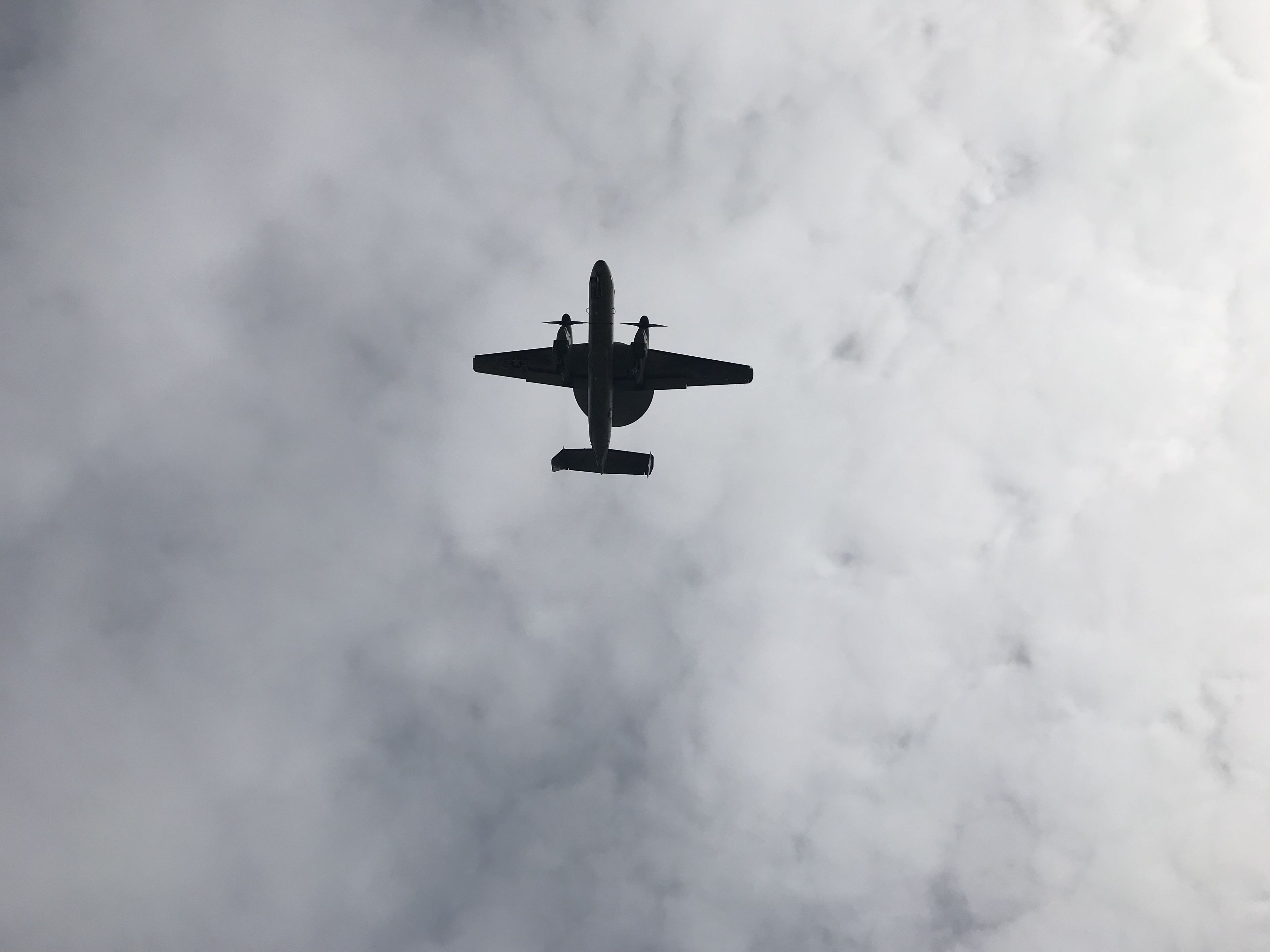 An airplane flying through clouds.