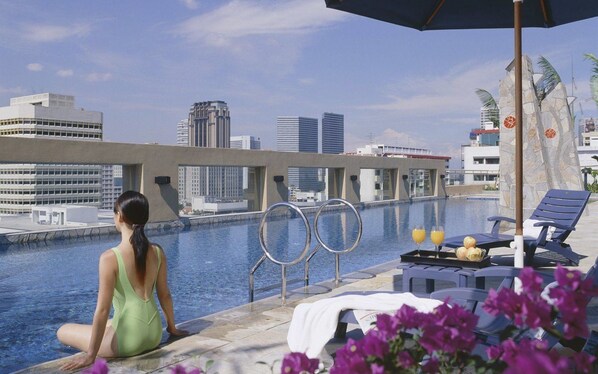 Outdoor pool, open 6:00 AM to 10:00 PM, sun loungers