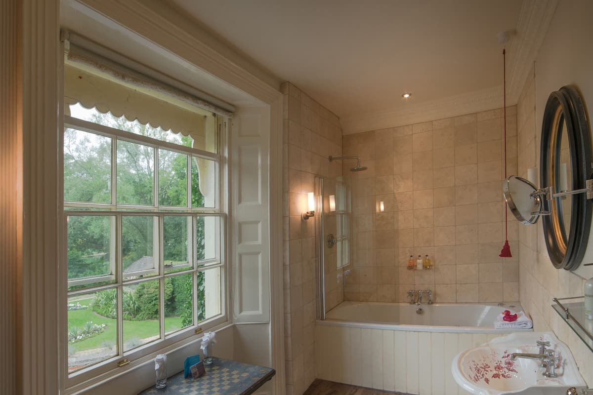 deluxe double or twin room | bathroom | hair dryer, towels