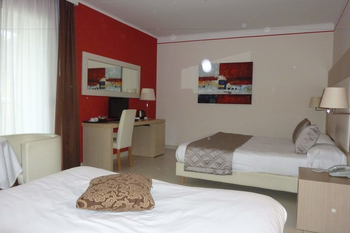 quadruple room | premium bedding, minibar, in-room safe, desk