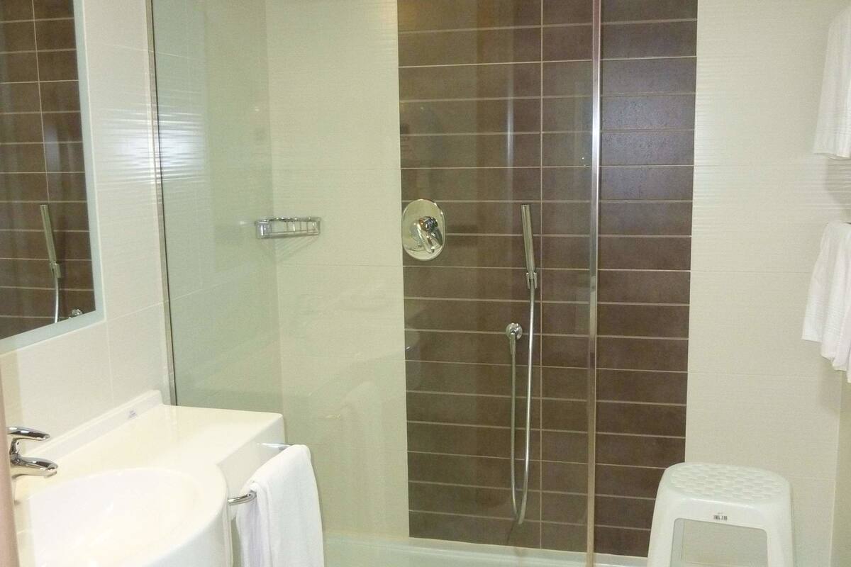 triple room | bathroom | shower, designer toiletries, hair dryer, bathrobes