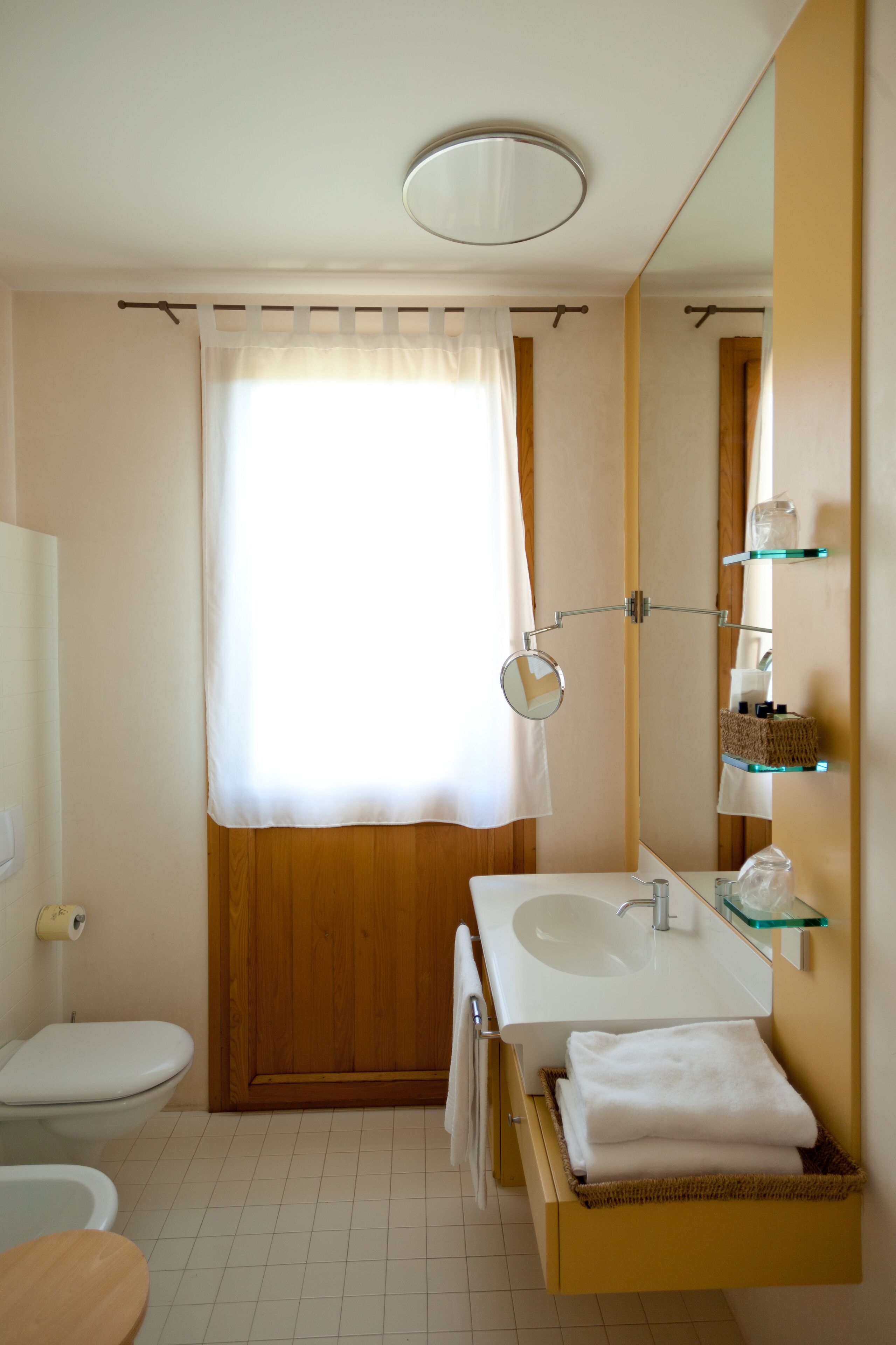 hair dryer, slippers, bidet, towels