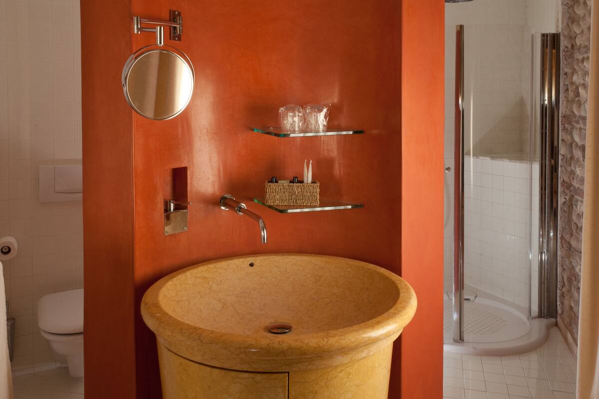 superior room, 1 queen bed | bathroom | hair dryer, slippers, bidet, towels