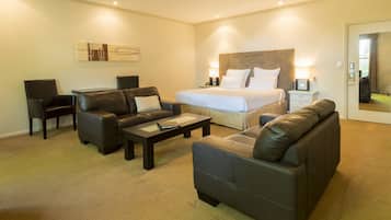 Deluxe King Suite | Premium bedding, pillow-top beds, blackout curtains, iron/ironing board