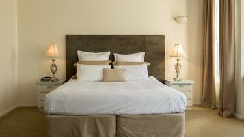 Premium bedding, pillow-top beds, blackout curtains, iron/ironing board