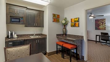 Suite, 1 King Bed, Non Smoking | Pillowtop beds, in-room safe, blackout drapes, iron/ironing board