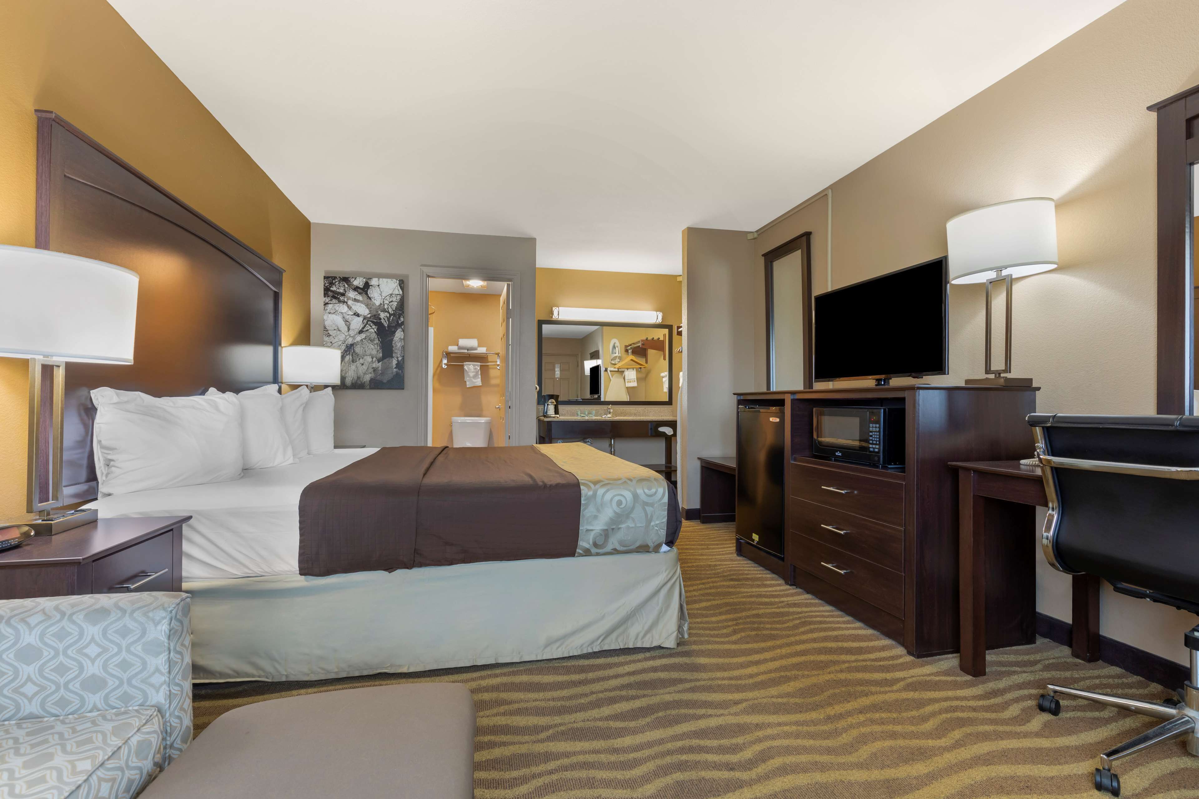 standard room, 1 king bed, accessible, non smoking | in-room safe, desk, laptop workspace, iron/ironing board