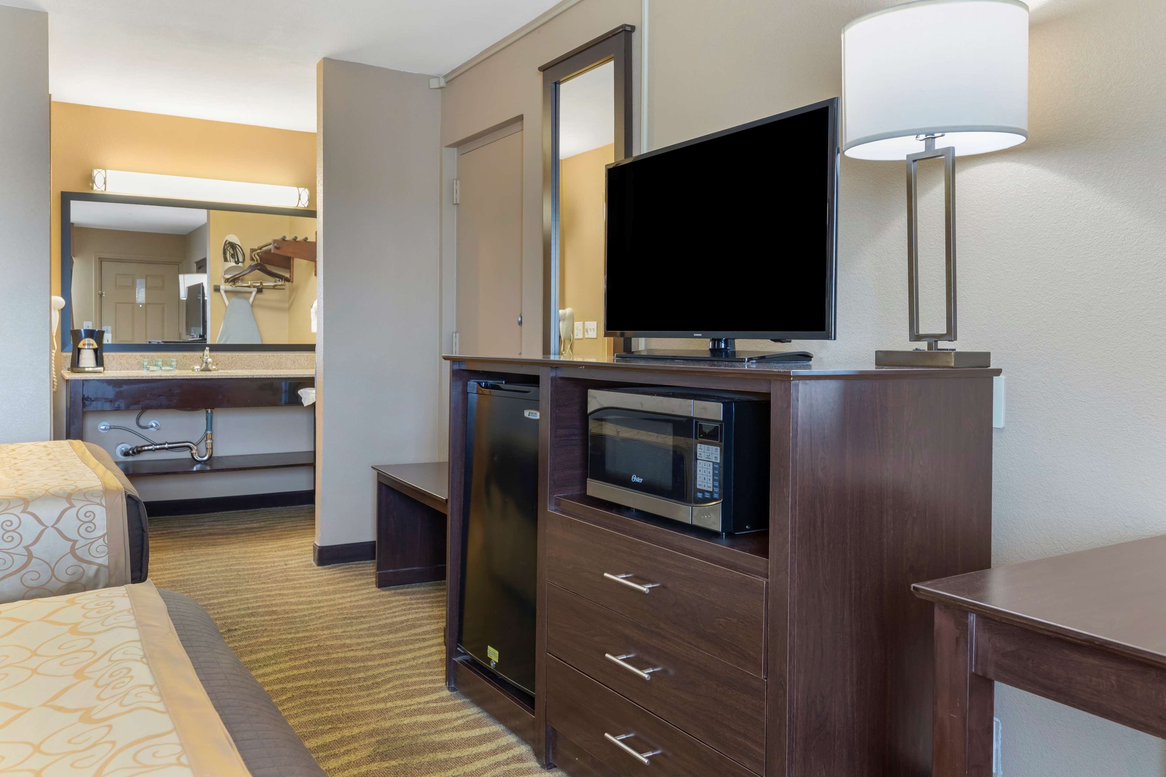 standard room, 2 double beds, non smoking, refrigerator & microwave | in-room safe, desk, laptop workspace, iron/ironing board