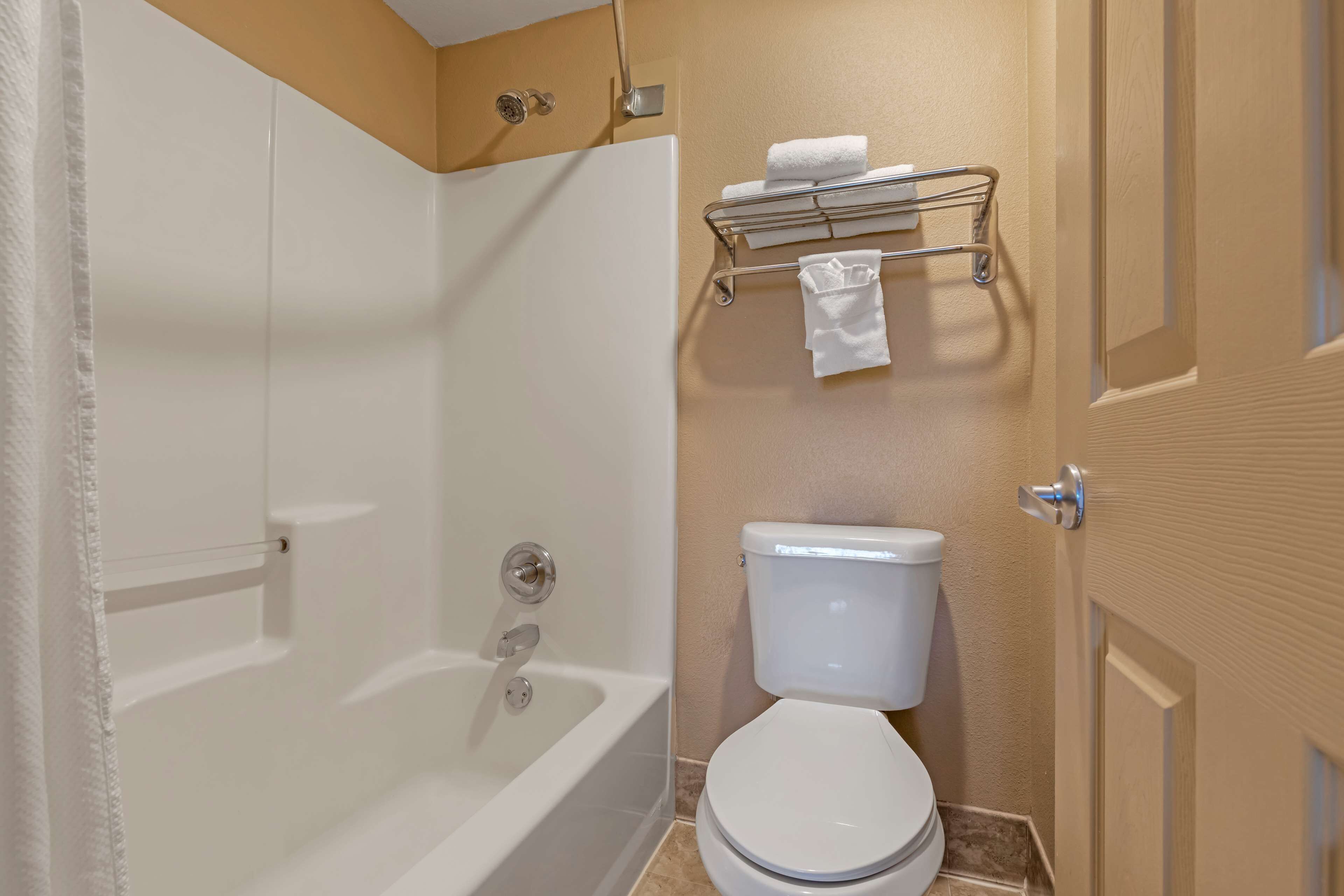 standard room, 1 king bed, non smoking, refrigerator & microwave | bathroom | hair dryer, towels, soap, shampoo