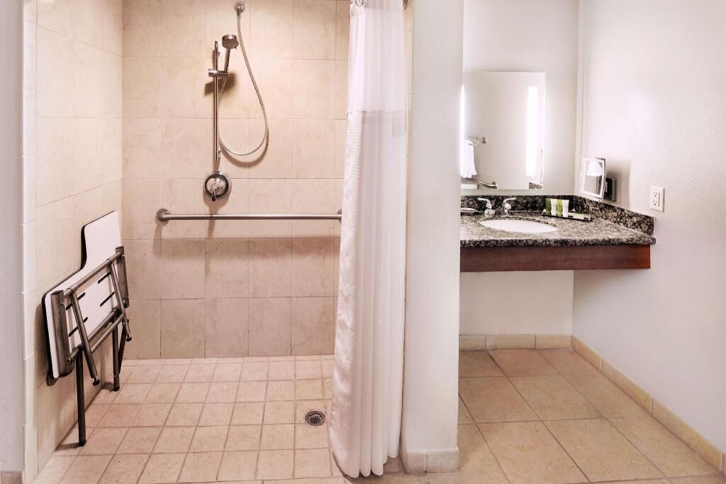 Designer toiletries, hair dryer, towels