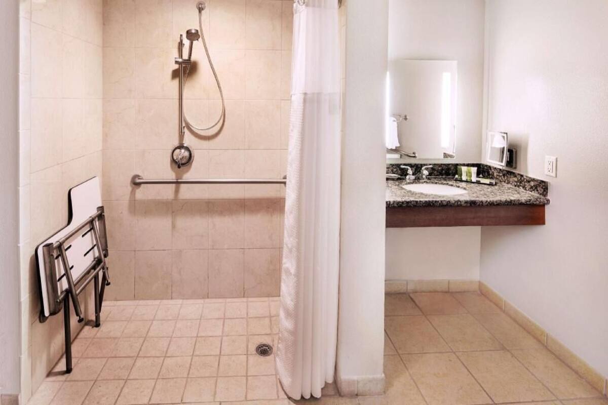 Designer toiletries, hair dryer, towels
