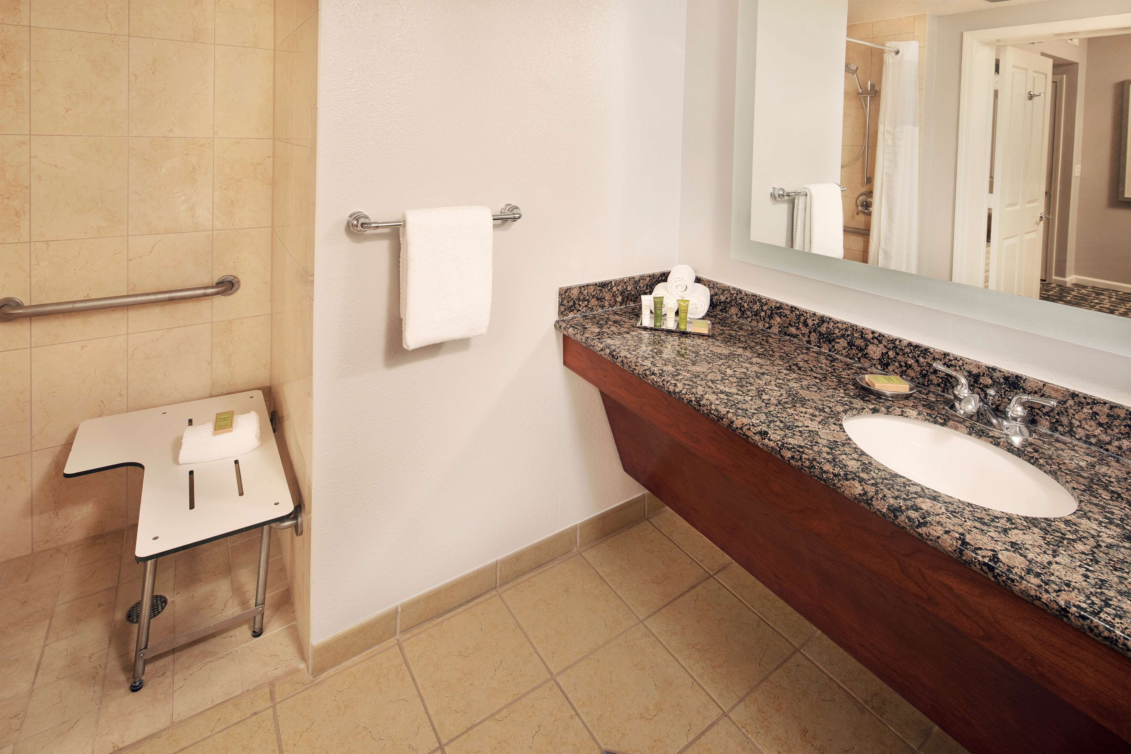 designer toiletries, hair dryer, towels