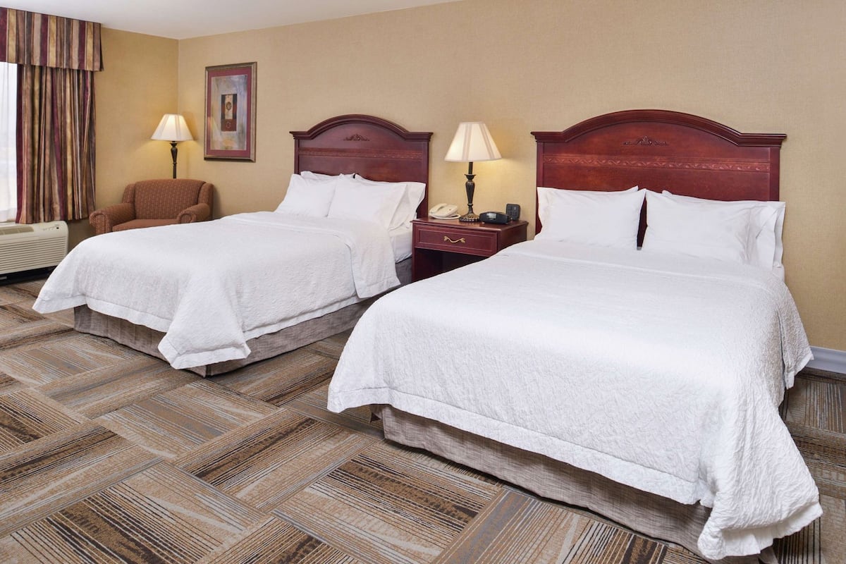 Down duvets, pillow-top beds, in-room safe, desk