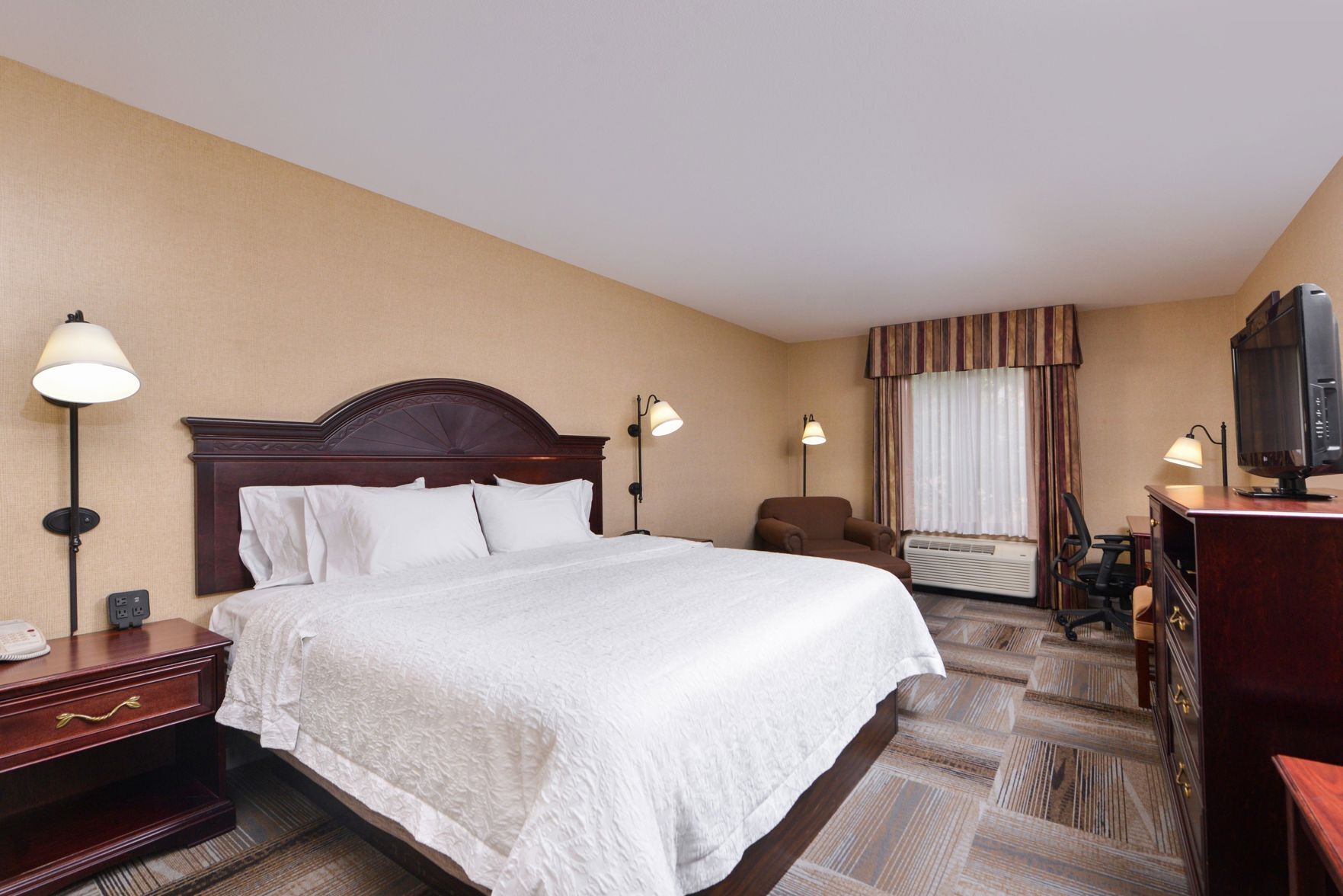 Down duvets, pillow-top beds, in-room safe, desk