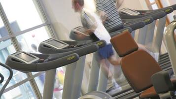 A gym with treadmills and exercise equipment.