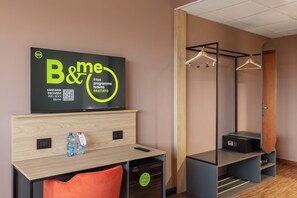 Hypo-allergenic bedding, down duvets, desk, laptop workspace