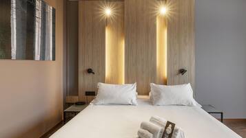 Hypo-allergenic bedding, down duvets, desk, laptop workspace