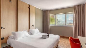 Hypo-allergenic bedding, down comforters, desk, laptop workspace