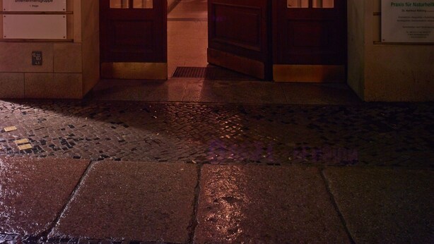 The entrance to Hotel Korfürst Pension with a sign above the doors and several informational signs on the walls. - Kurfürst am Kurfürstendamm (Berlin)