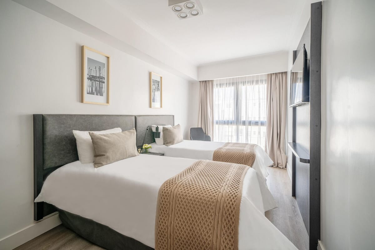 Premium bedding, down comforters, pillowtop beds, minibar