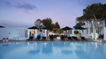 Seasonal outdoor pool, open 11:00 AM to 8:30 PM, pool umbrellas