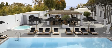 Seasonal outdoor pool, open 11:00 AM to 8:30 PM, pool umbrellas