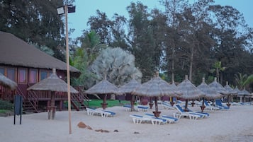 On the beach, sun loungers, beach umbrellas, beach towels