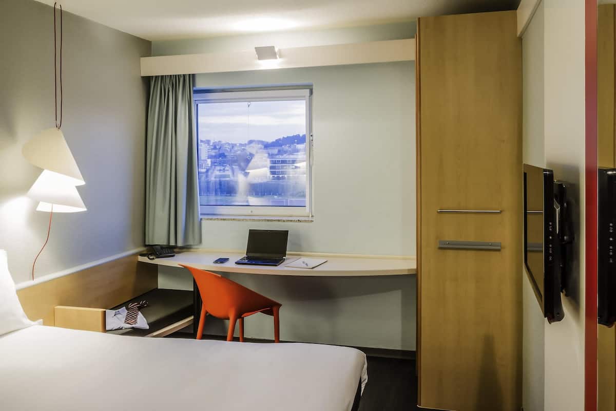 Desk, laptop workspace, blackout curtains, soundproofing